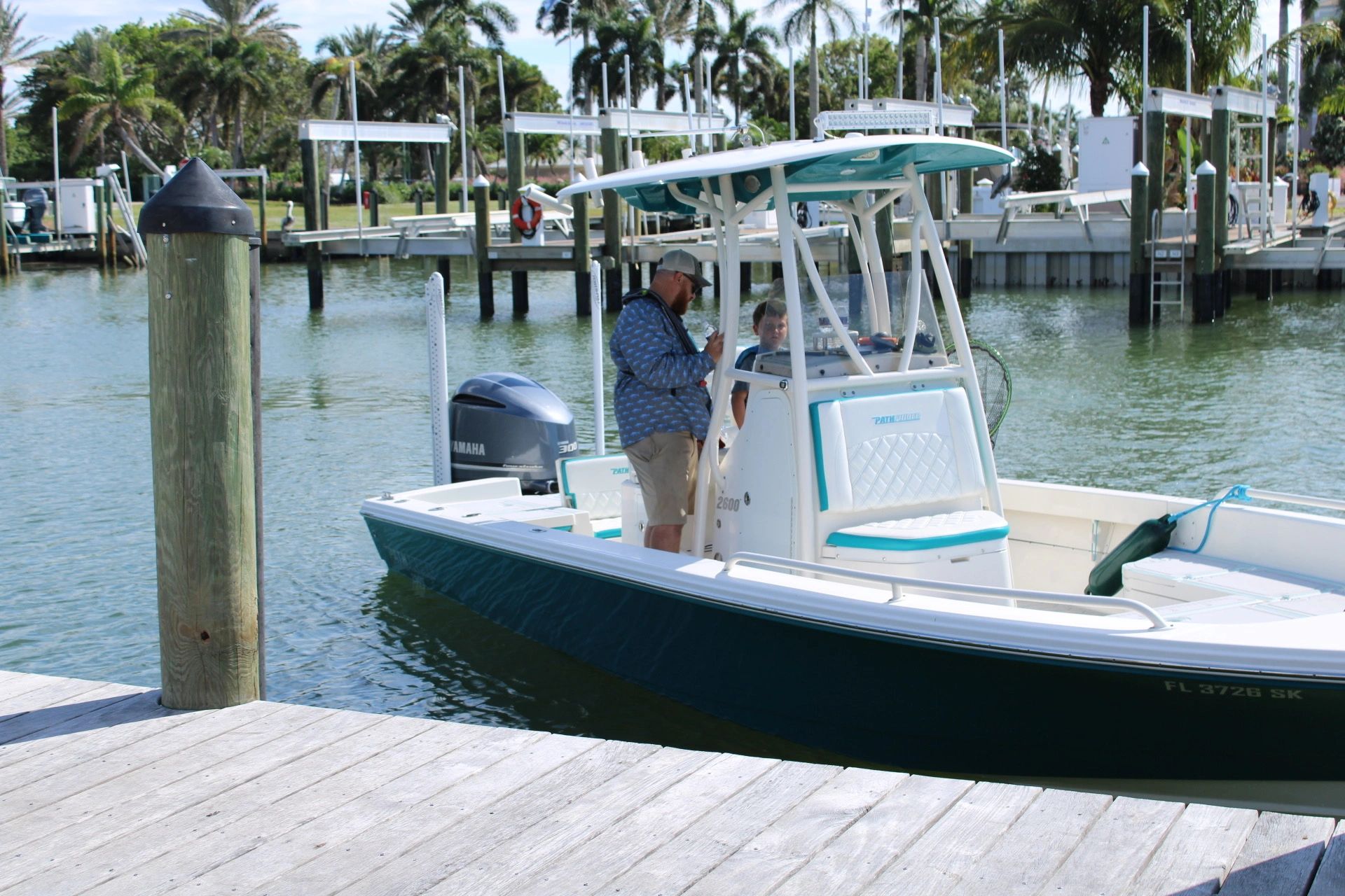 SafeSea captain on a fishing boat at a Naples marina